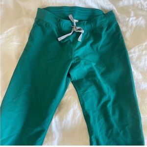 Figs pants in forest green medium tall